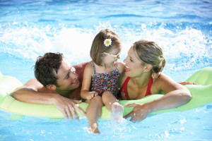 family enjoying the pool