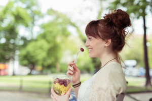 woman enjoying a snack while Pigeon Forge shopping