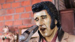 An old statue of Elvis Presley.